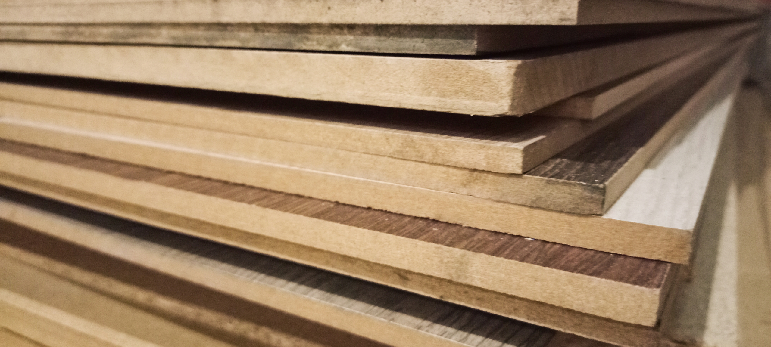 various plywood sheets stacked together, showcasing different types and textures